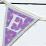Purple cross stitch bunting letter E flag