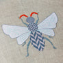 Cross stitch insect pattern featuring herringbone design in it's body.