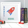 Flashing image showing cross stitched rocket pattern by day and by night