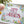 Banner which says This Took me Ages in cross stitch surrounded by flowers