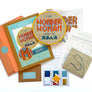 Wonder Woman cross stitch kit with packaging, threads, pattern and fabric
