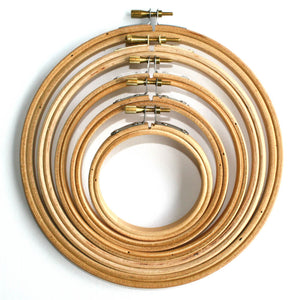 Wooden embroidery hoops from 3 inch to 7 inch placed inside one another