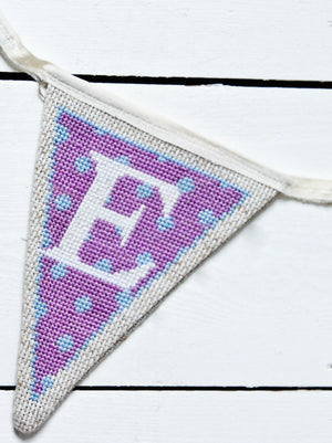 Purple cross stitch bunting letter E flag