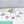 Cross stitch alphabet bunting spells out James on the floor around toy dinosaurs