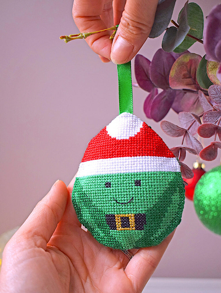 Stitched sprout Christmas decoration being hung on tree