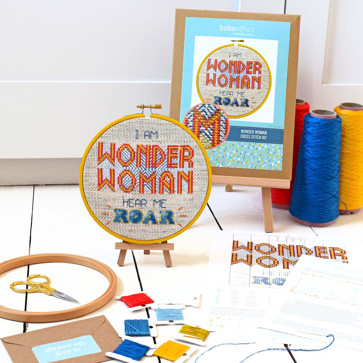 Wonder Woman cross stitch kit with packaging, threads, pattern and fabric