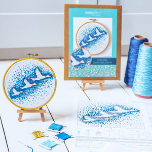 Flying duck cross stitch kit packaging and contents including instructions, fabric and threads