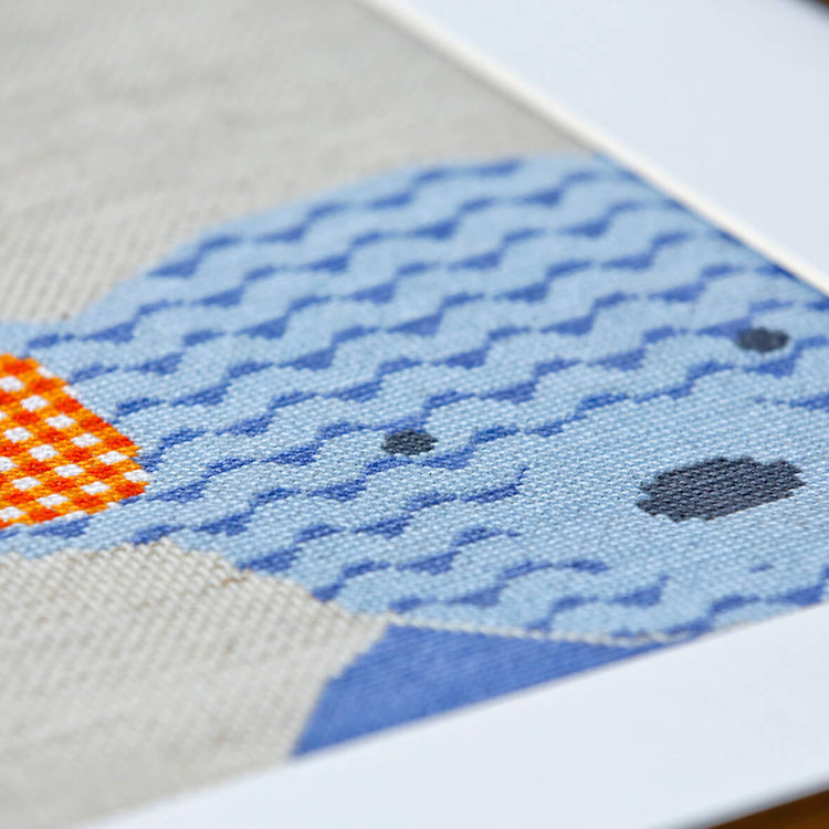 Close up of stitches in the blue teddy cross stitch design