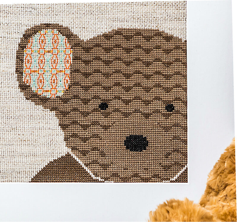 Brown teddy cross stitch pattern close up