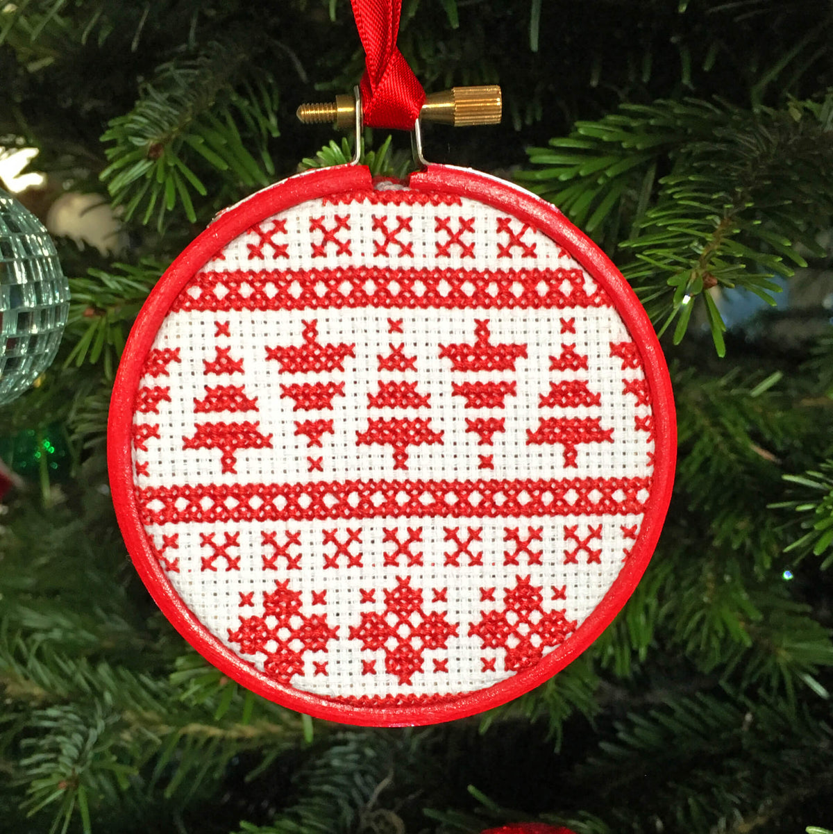 3 inch hoop cross stitch Christmas bauble in red and white Scandi or Nordic pattern