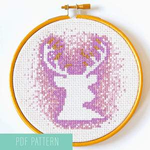 Cross stitch stag with antlers - negative space with purple stitches in five inch hoop