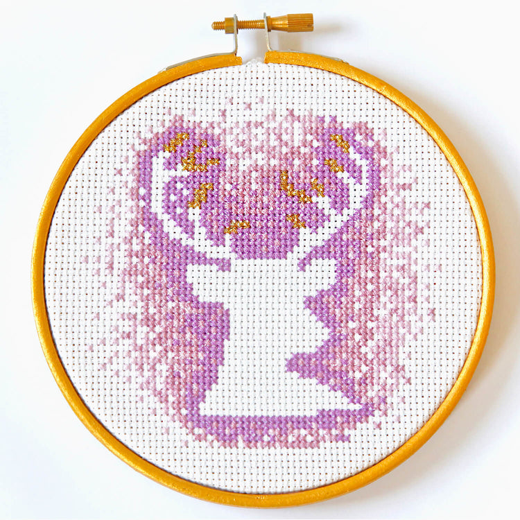 Cross stitch stag with antlers - negative space with purple stitches in five inch hoop
