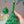 Person hanging cross stitch Christmas tree decoration