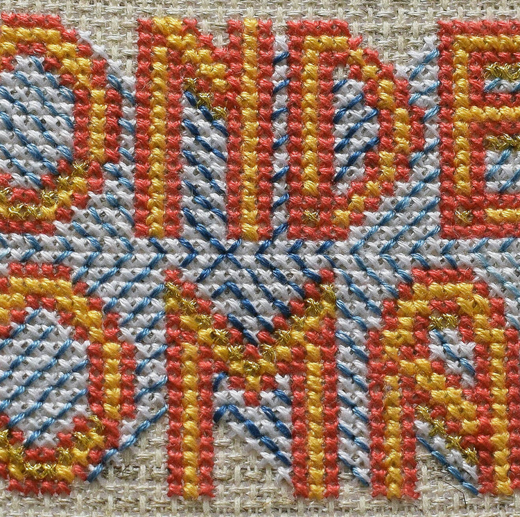 Close up section of stitches from Wonder Woman pattern