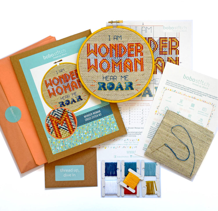 Wonder Woman cross stitch kit with packaging, threads, pattern and fabric